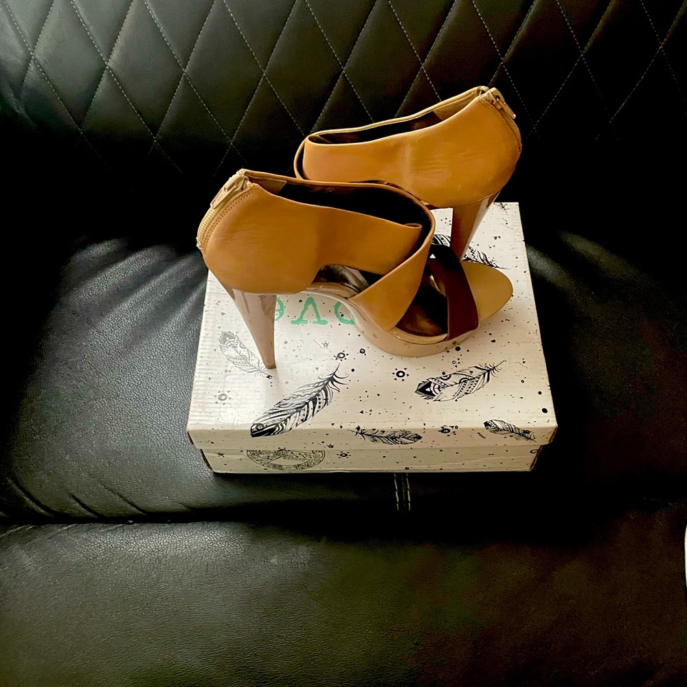 Tan and chocolate brown platform heels.